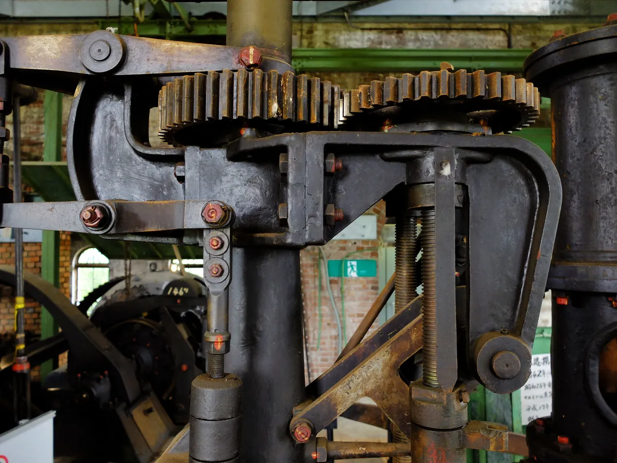 Detail of very large gears on a piece of industrial equipment, purpose unknown.
