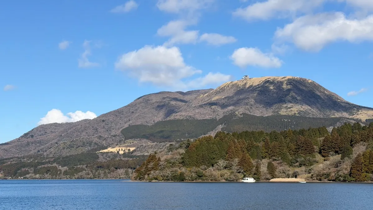 Mount Koma in Hakone, Japan, as seen from the shore of Lake Ashi. It's January, so foliage is brown, but there are few trees on Mount Koma anyway.
